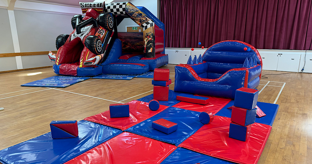 3D F1 Race Car Bounce n’ Slide with ball pool package set up at an indoor venue in Aberford