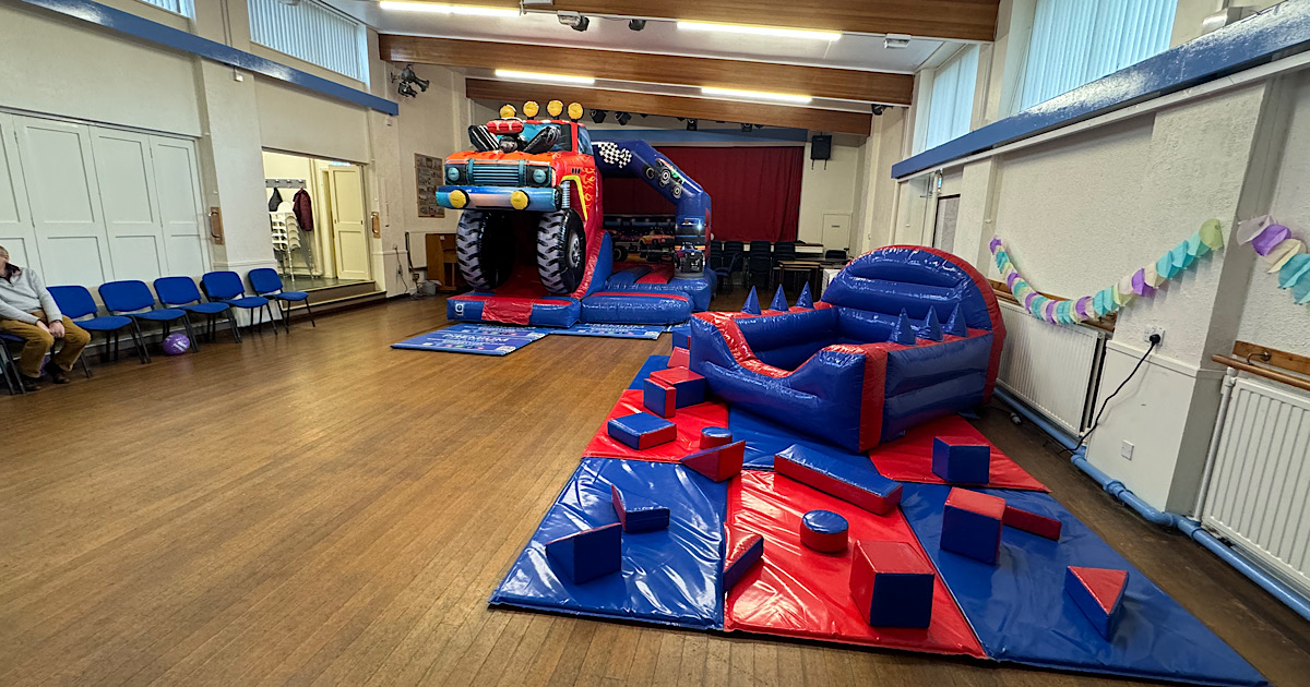 Monster truck themed bouncy castle party setup at Cookridge Village Hall Leeds LS16